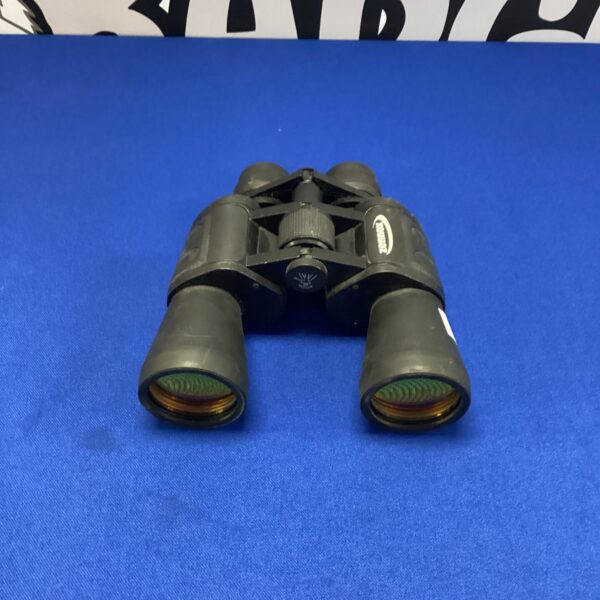 Vintage green Zennox field binoculars for outdoor observation.