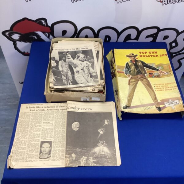 Vintage newspaper cuttings documenting the 1969 moon landing.