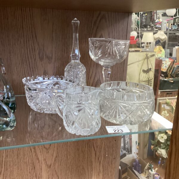Vintage cut glass milk jug and bowl on display.