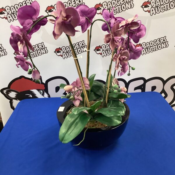 Purple artificial orchid, a beautiful home decor flower arrangement.