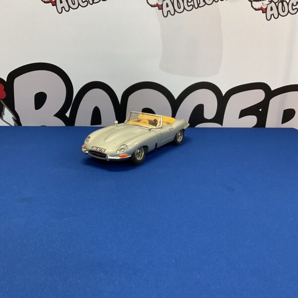Cream coloured 1961 Jaguar E Type diecast model car.