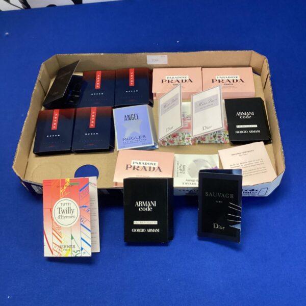 Perfume and aftershave tester lot including Dior Sauvage and Prada fragrances.