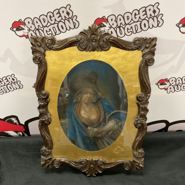 Antique pastel portrait of a flower girl in a carved oak frame.