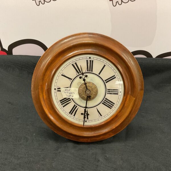 Vintage post office wall clock with enamel face and wooden case.