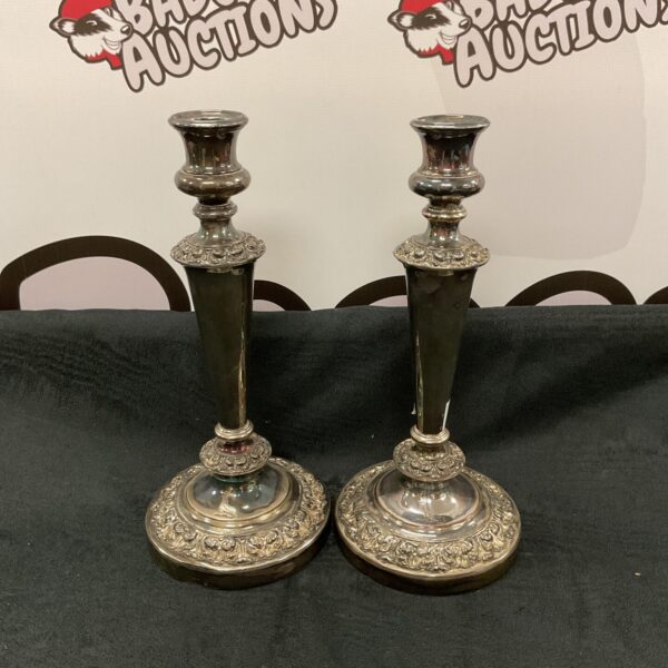 Antique Victorian silver plate candlesticks with dove motif.