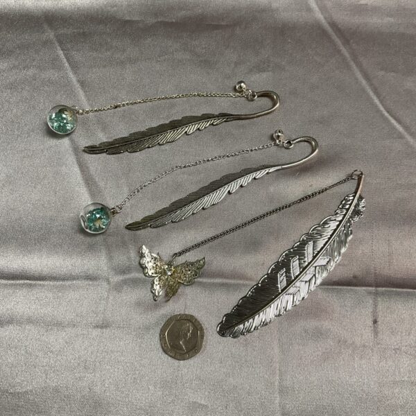 Vintage silver plate bookmark with floral design.