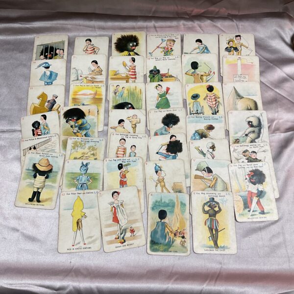 Antique Sarah Jane playing cards featuring Golly and Peg.