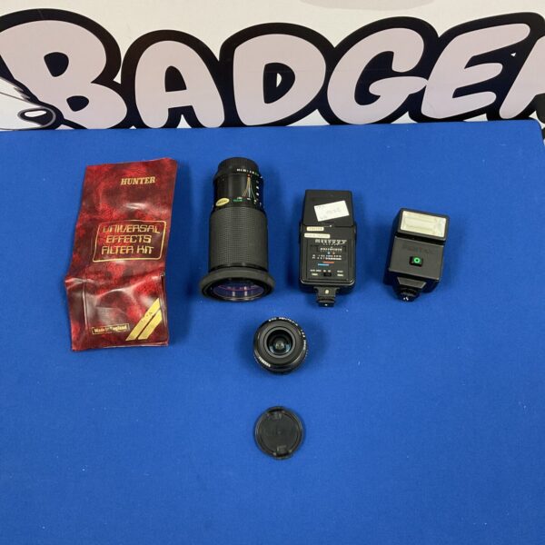 Vintage camera accessories lot including lenses and filters.
