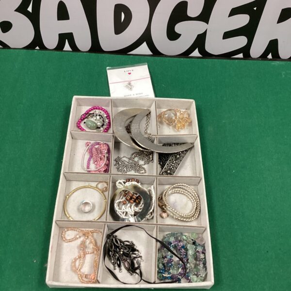 Assorted costume jewellery lot with necklaces, earrings, and bracelets.