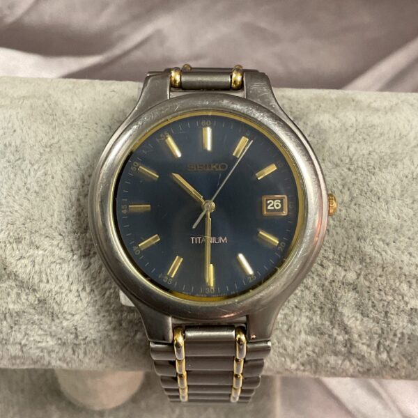 Close-up of a blue dial Seiko titanium wristwatch.