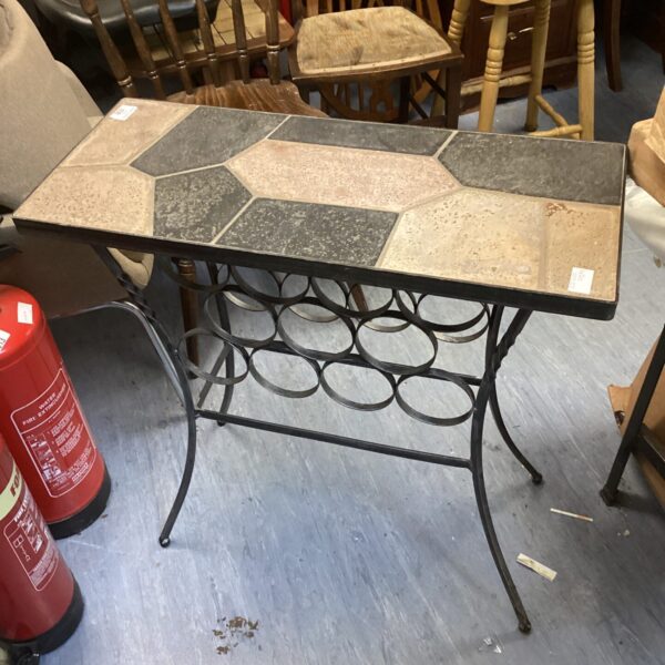 Stone topped wine rack table with metal frame.