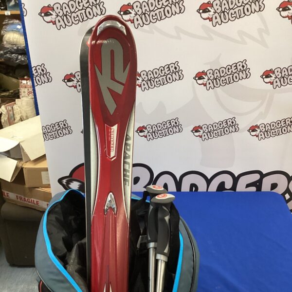 Red K2 Stryker ski set with poles and bag.