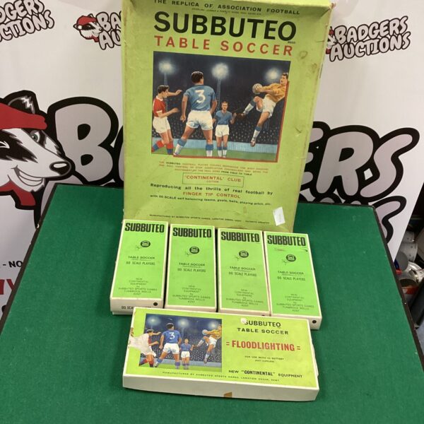 Vintage Subuteo table soccer set with figures and pitch.