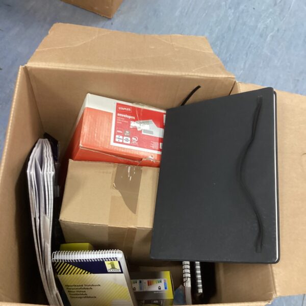 Mixed lot of office supplies including envelopes and stationery.
