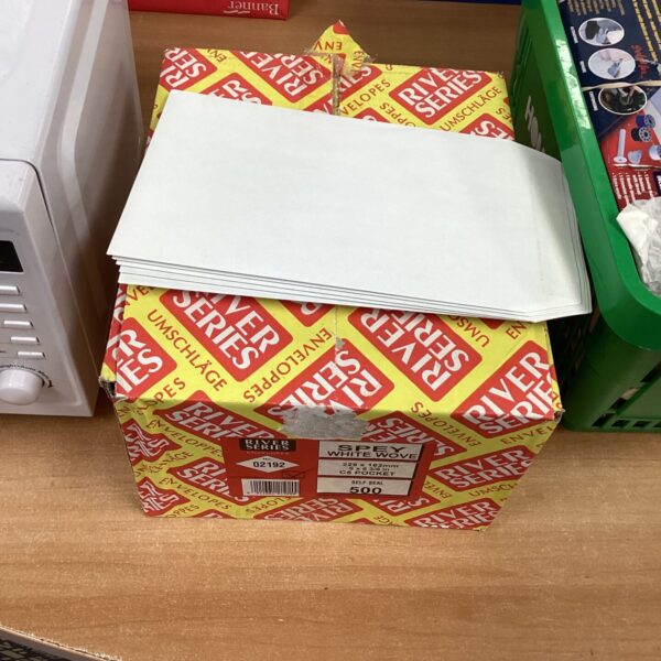 Stack of River Series 500 white pocket envelopes for mailing.