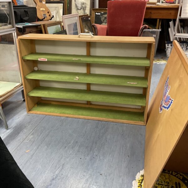 Vintage wooden display case with tiered shelving for collectibles.