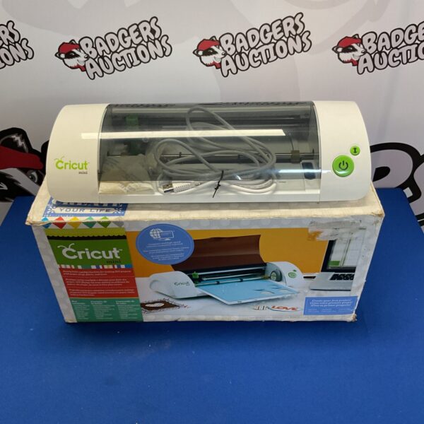 Side view of a Cricut Mini crafting machine.