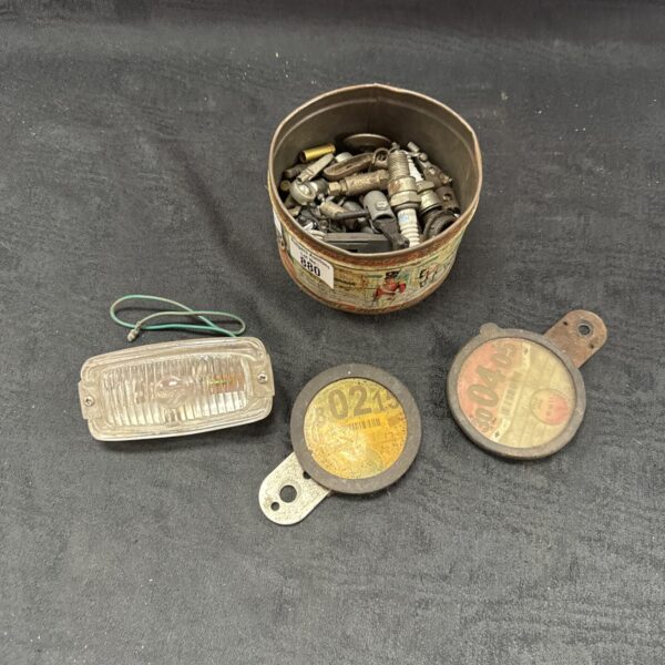 Vintage motoring spares lot with Lucas headlamp and bulb box.