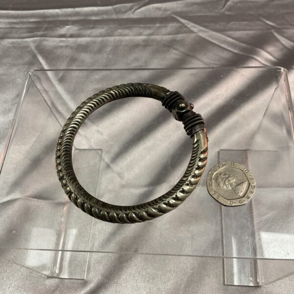 Close-up of a textured Indian silver bangle.