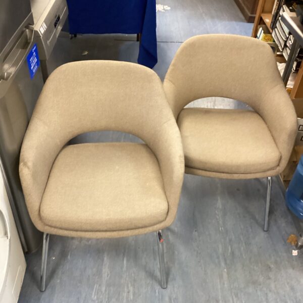 Vintage beige reception chairs with chrome legs.