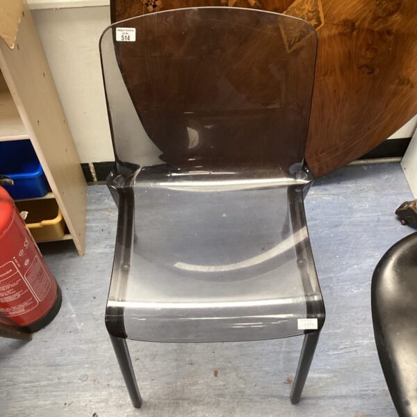 Clear perspex designer chair, modern style seating.