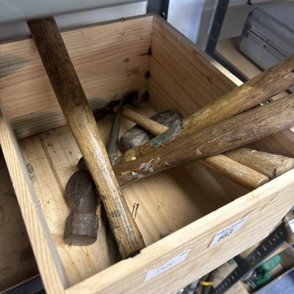 Vintage hammer collection with wooden handles and metal heads.