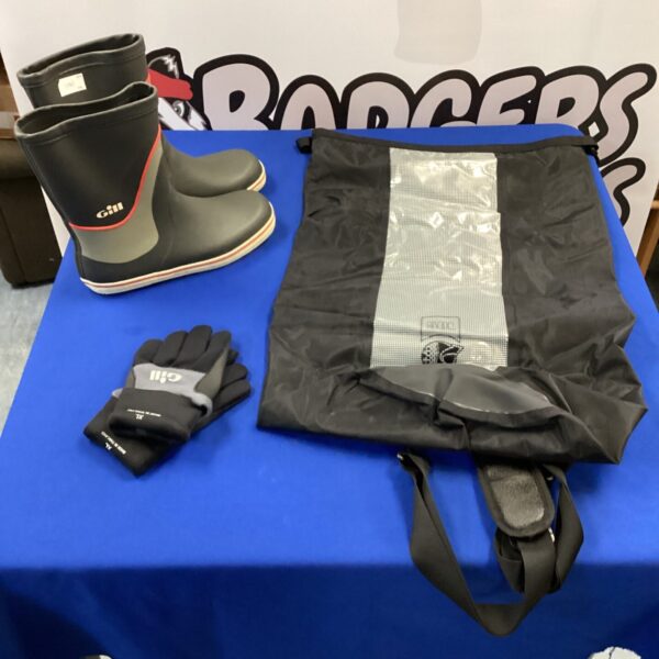 Gill sailing bundle featuring boots, gloves, and a waterproof bag.