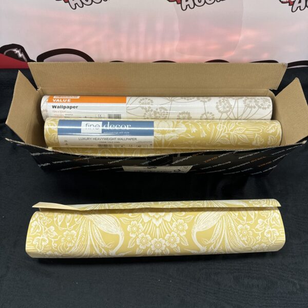 Sealed and partially used rolls of classic crane toile wallpaper.
