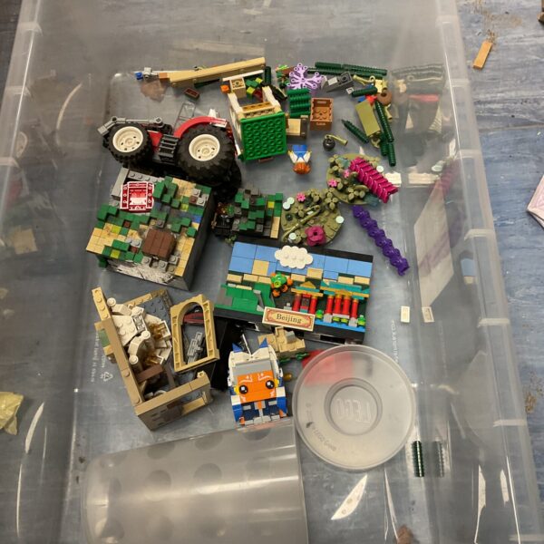 Colourful mixed Lego lot with assorted building blocks and pieces.