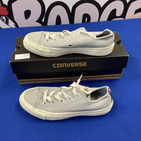 Children’s size 3 Converse trainers, showing wear and tear.