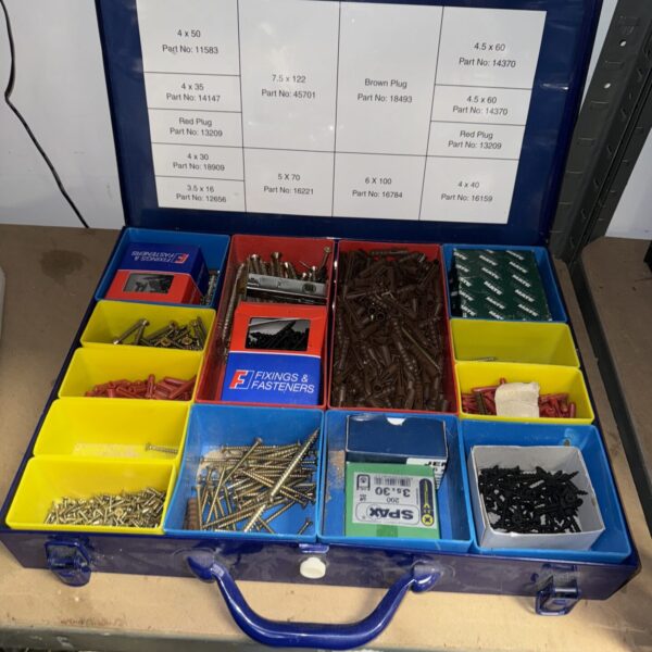 Vintage metal box filled with screws and rawl plugs.