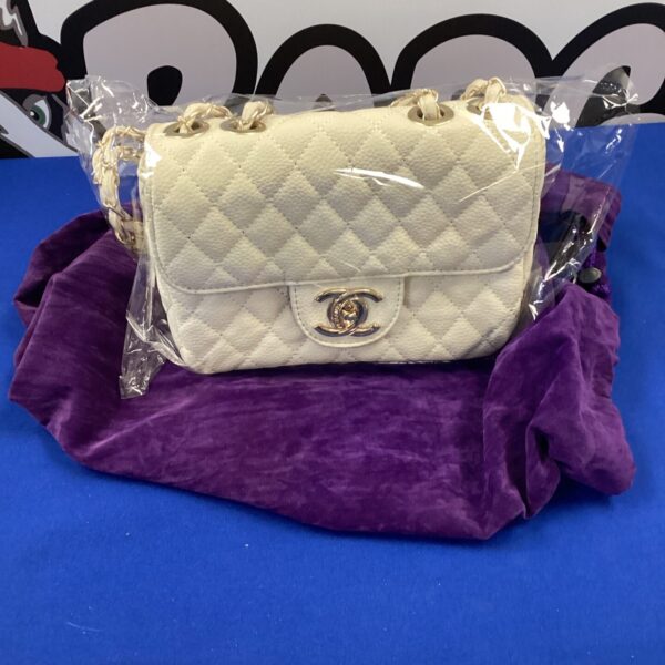 Vintage Chanel style crossbody bag with quilted leather.