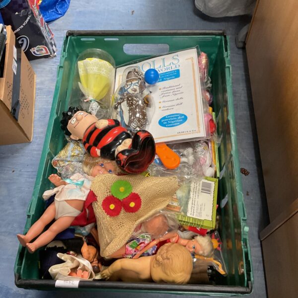 Vintage toy lot featuring dolls and a plush toy.