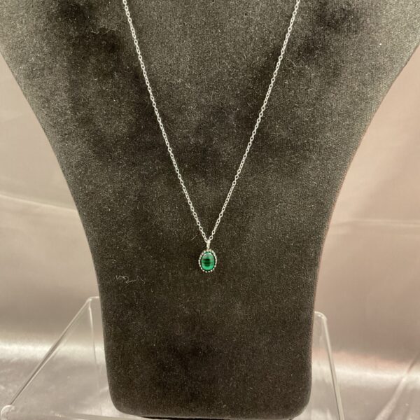 Silver malachite pendant necklace on a chain.