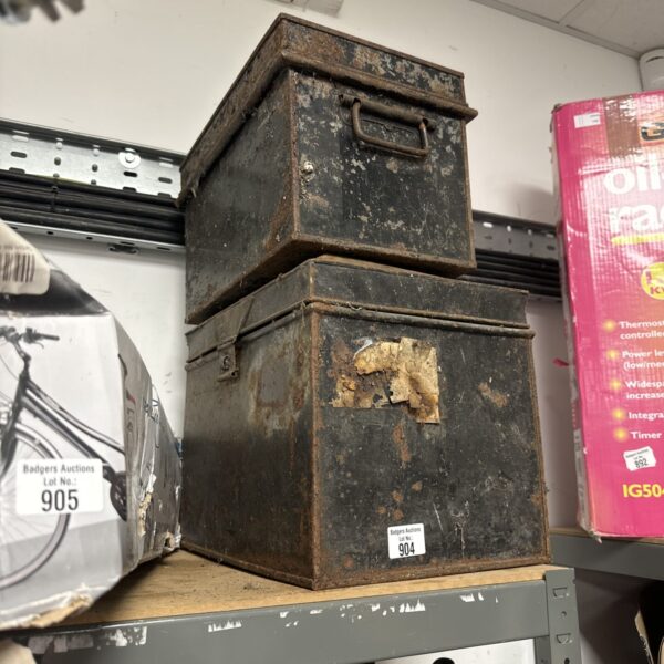 Rusty vintage metal storage box with a hinged lid.