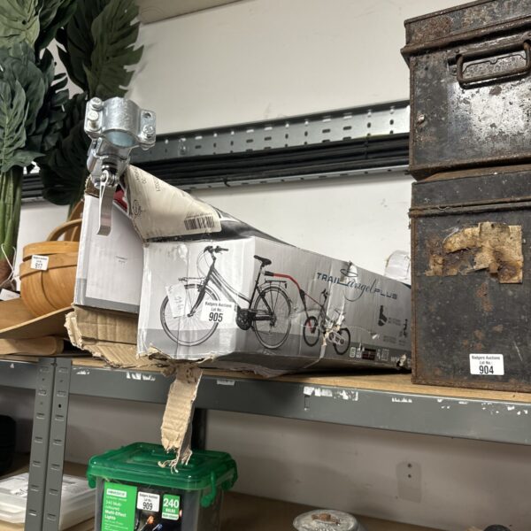 Used Trail Angel Plus children’s bicycle tow bar with packaging.