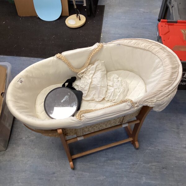 Vintage John Lewis baby rocking cot with woven basket and wooden frame.