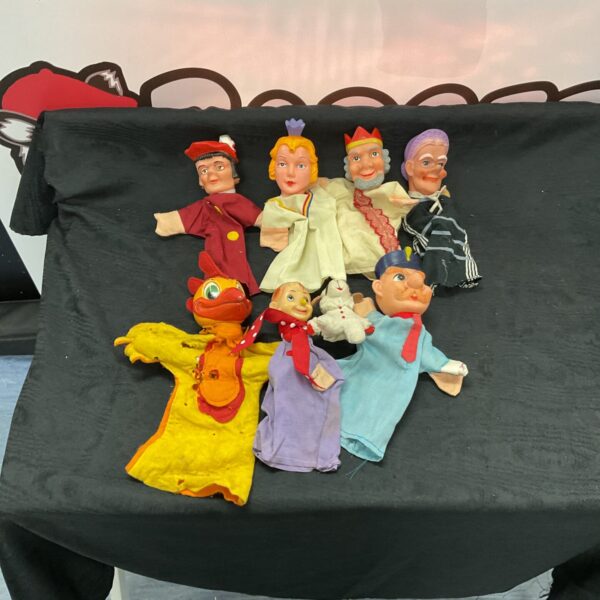 Vintage hand puppets collection featuring clown, king, and jester characters.