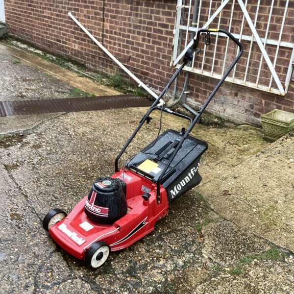 Mountfield petrol lawn mower in a garden setting.