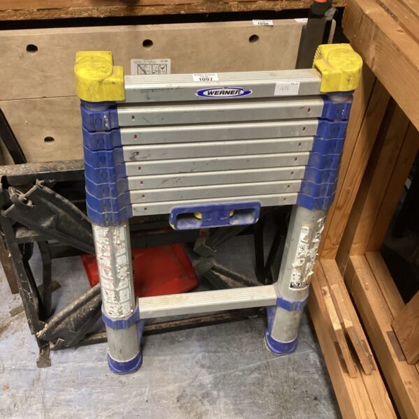 Front view of a Werner telescopic ladder in used condition.