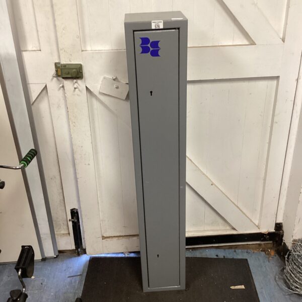 Metal gun cabinet for storing three shotguns securely.