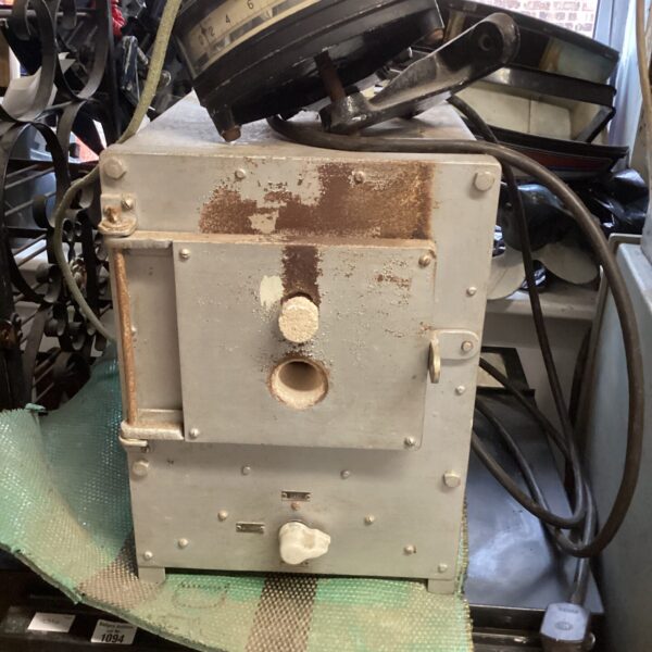 Vintage electric pottery kiln controller with numbered dial.