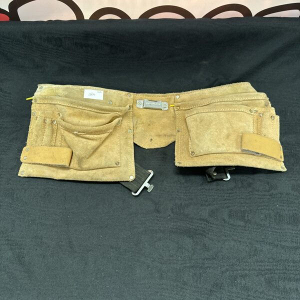 Vintage leather tool belt with multiple pouches for tools.