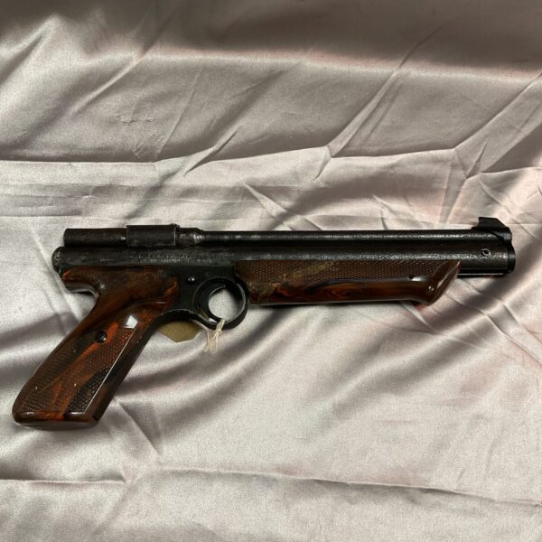 Vintage Crossman Medalist II .22 cal air pistol with wood grips.