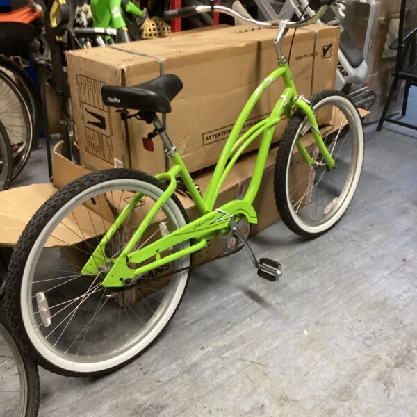 Side view of an Electra cruiser bike with a curved frame.