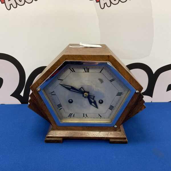 Vintage 1930s art deco mantle clock with wooden case.