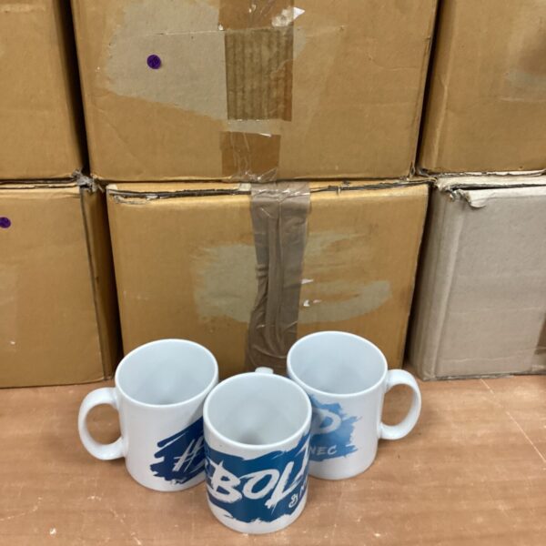 Close-up of branded mugs with bold and NEC logos.