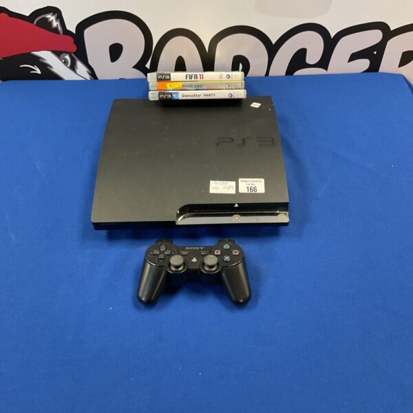 PlayStation 3 console with games and controller for retro gaming.