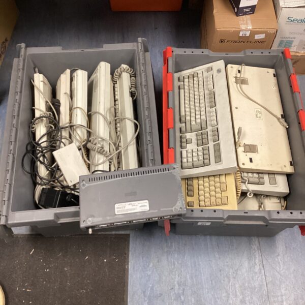 Lot of vintage retro computer keyboards and networking tool.