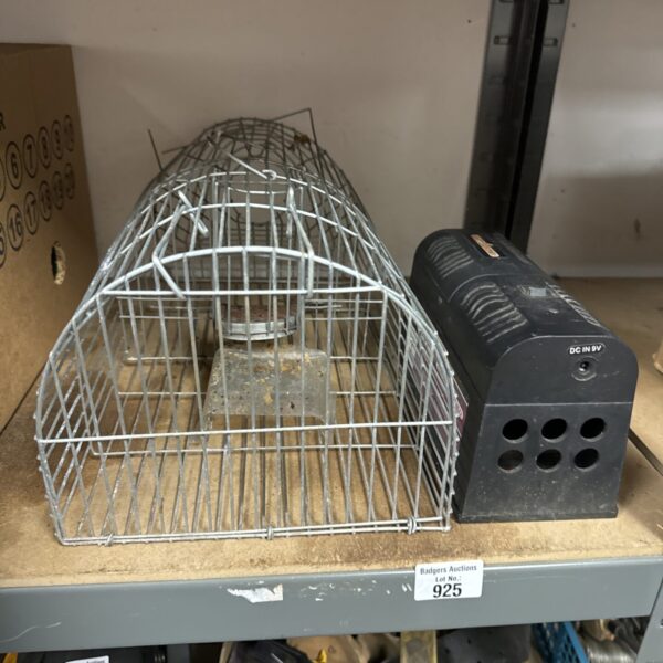 Pair of rat traps including a Rat Zinger electric trap.
